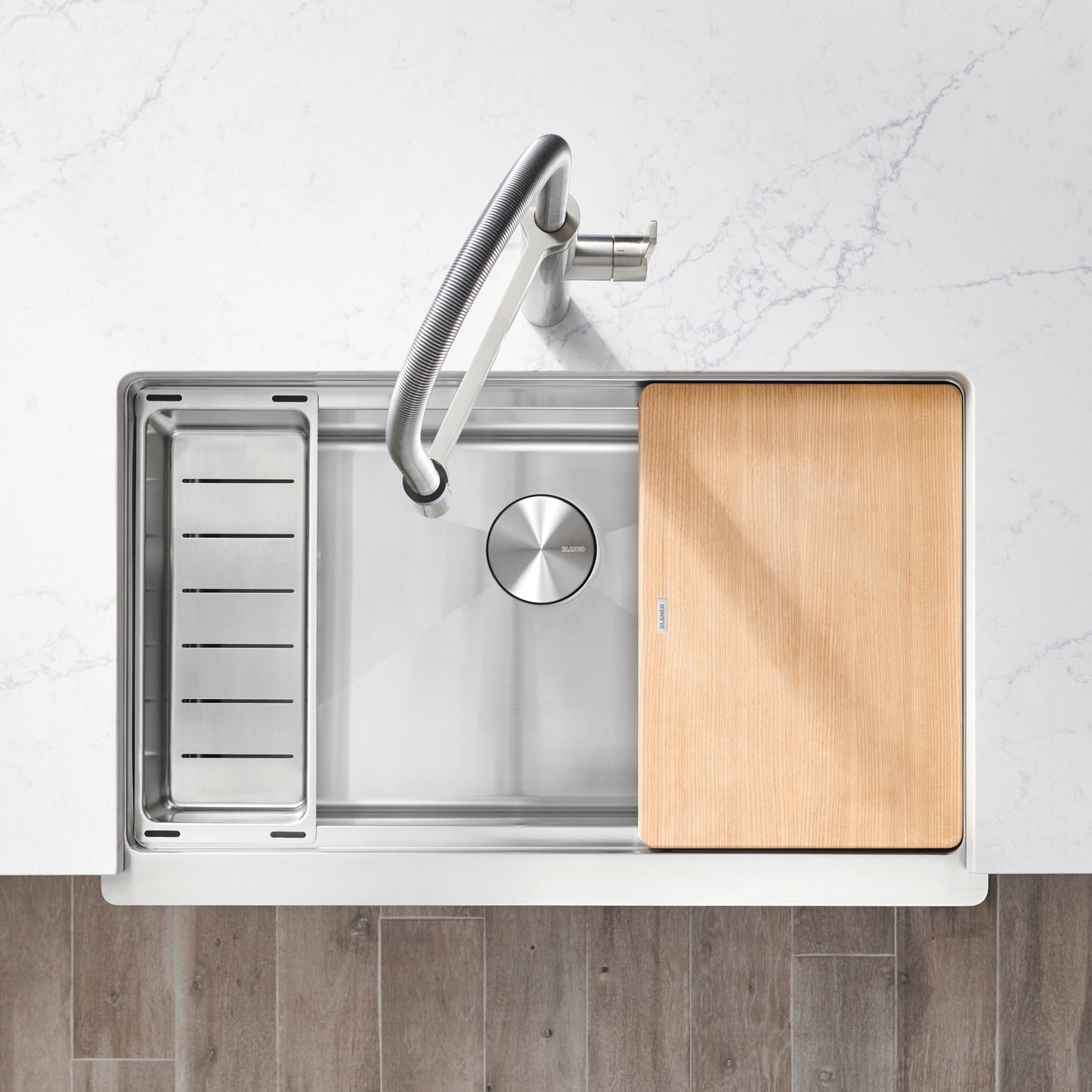 BLANCO Quatrus R15 Ergon 33" Single Bowl Apron-Front Stainless Steel Farmhouse Sink with wooden cutting board.