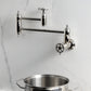 Kingston Brass KS3103CG Fuller Wall Mount Pot Filler Faucet, Antique Brass in a modern kitchen setting
