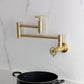 Kingston Brass KS8103CG Fuller Wall Mount Pot Filler Faucet, Antique Brass with foldable swing arms and traditional design.