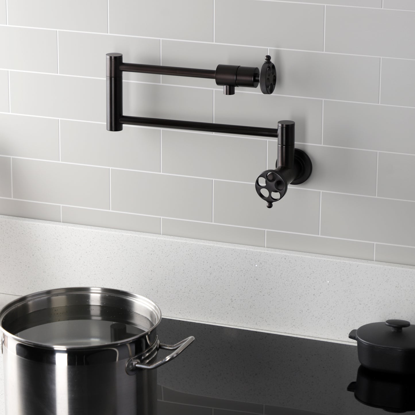Kingston Brass KS4103RKZ Wendell Wall Mount Pot Filler Faucet with Knurled Handle, Antique Brass in modern kitchen setting.