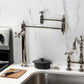 Kingston Brass KS3703AX Restoration Deck Mount Pot Filler Faucet, Antique Brass in a modern kitchen setting.