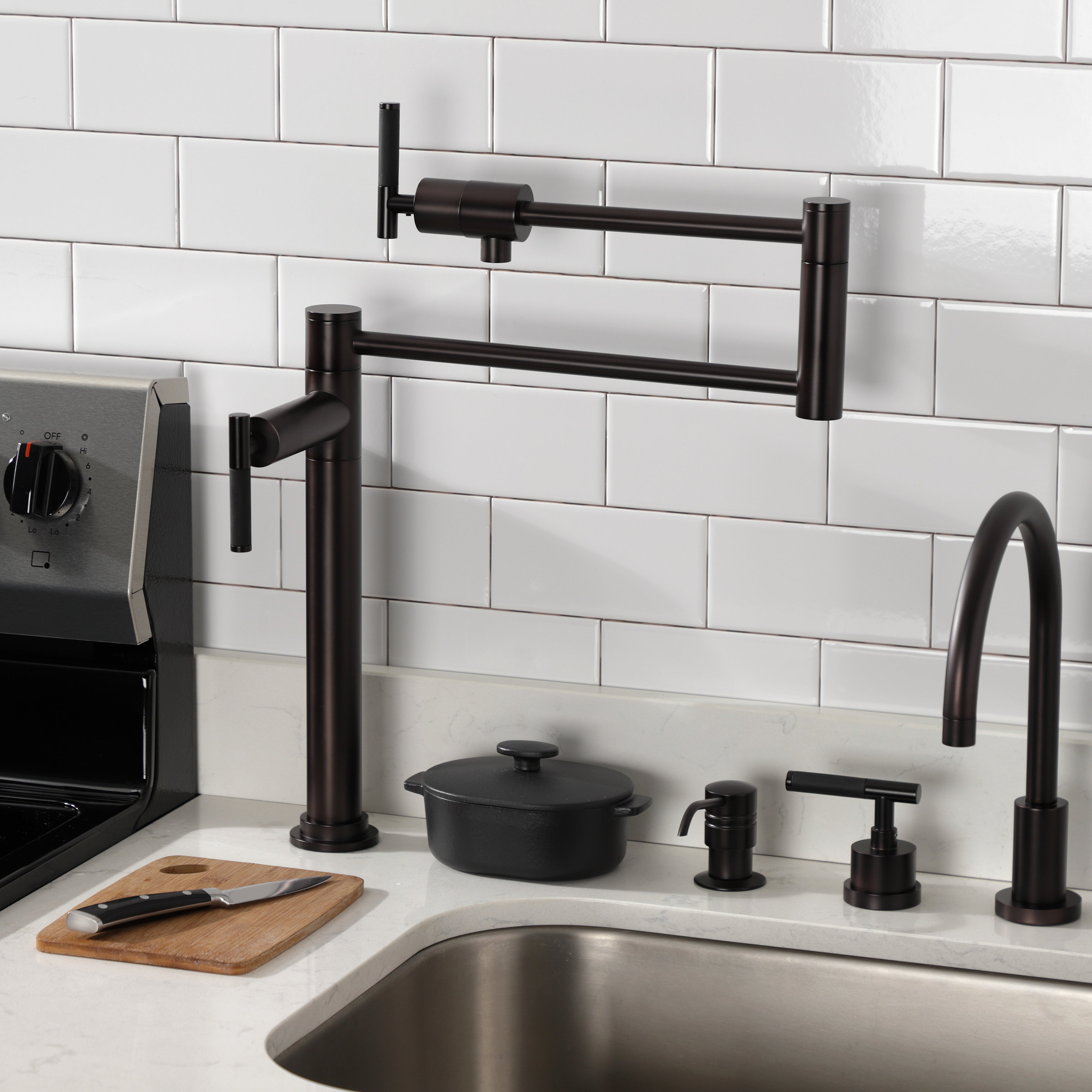 Kingston Brass KS4703CKL Kaiser Deck Mount Pot Filler Faucet, Antique Brass in modern kitchen setting.