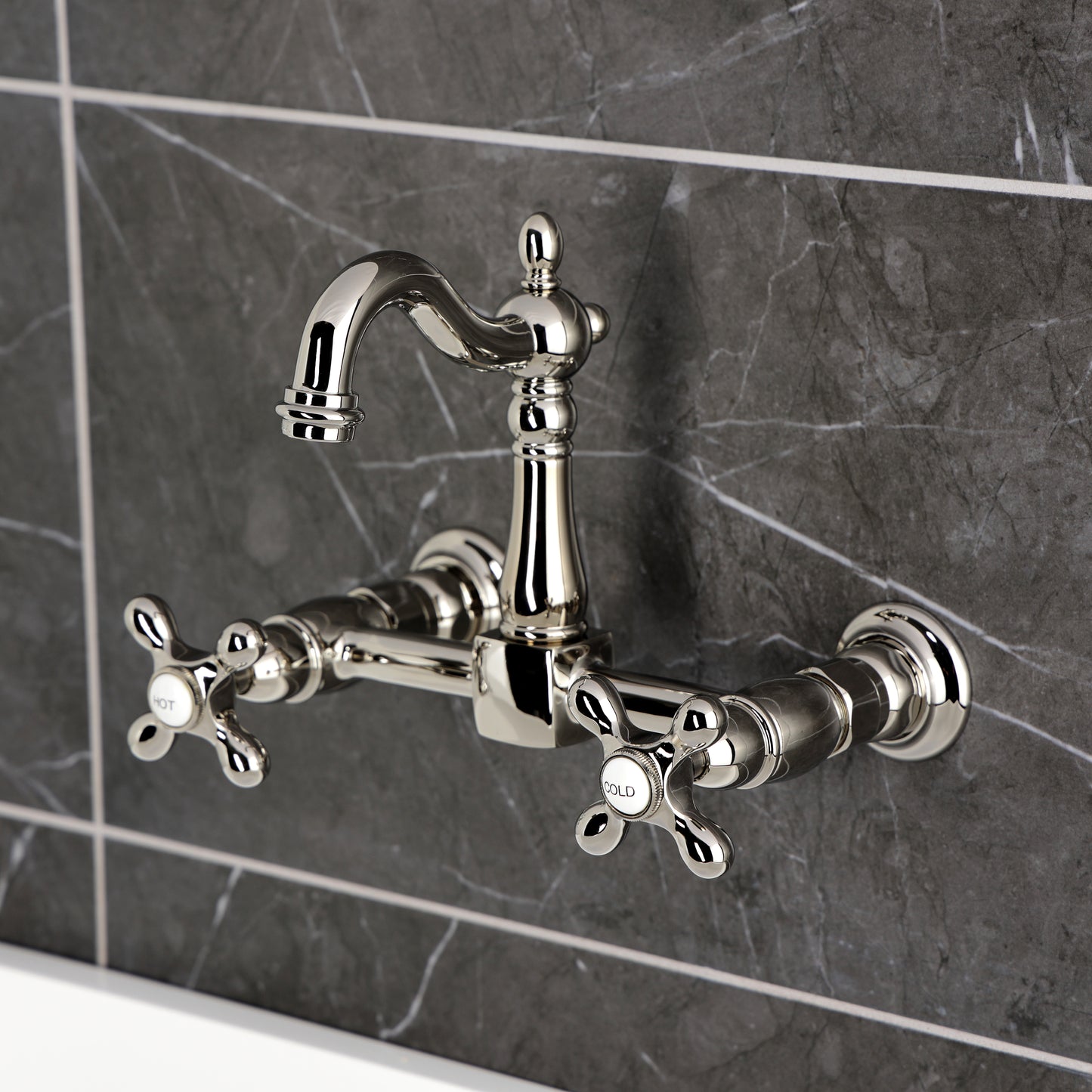 Kingston KS2443AX Heritage Two-Handle Wall Mount Bridge Kitchen Faucet, Antique Brass in a stylish setting