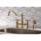 Kingston KS3277AXBS Restoration Bridge Kitchen Faucet with Brass Sprayer, Brushed Brass on decorative backsplash.