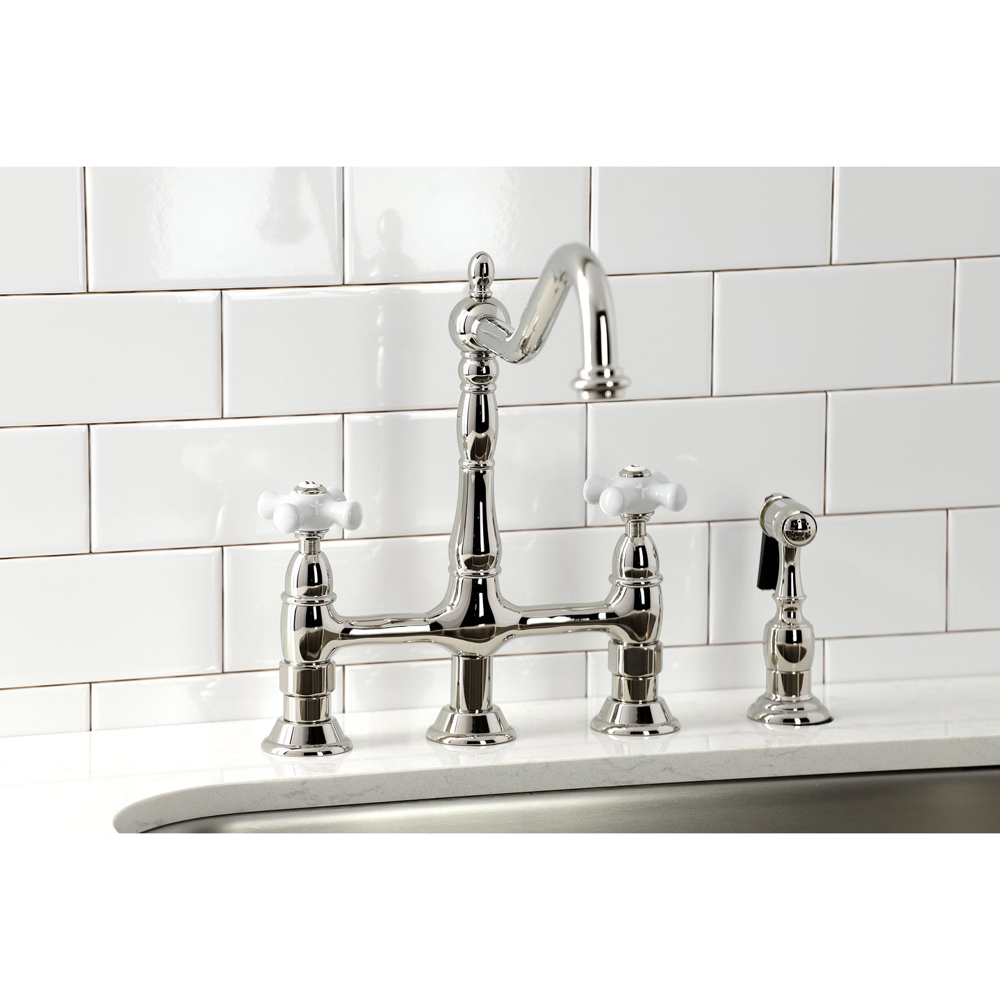Kingston Brass Heritage Bridge Kitchen Faucet with Brass Sprayer and Cross Handles in polished chrome finish