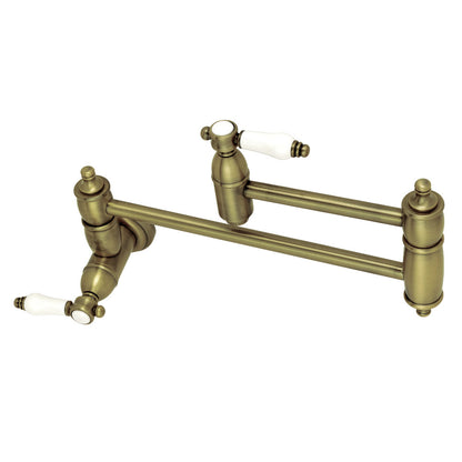 Kingston Brass KS3103BPL Bel-Air Wall Mount Pot Filler Faucet, Antique Brass with white porcelain levers and foldable swing arms.