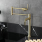 Kingston Brass KS4703KL Whitaker Deck Mount Pot Filler Faucet, Antique Brass in a modern kitchen setting.