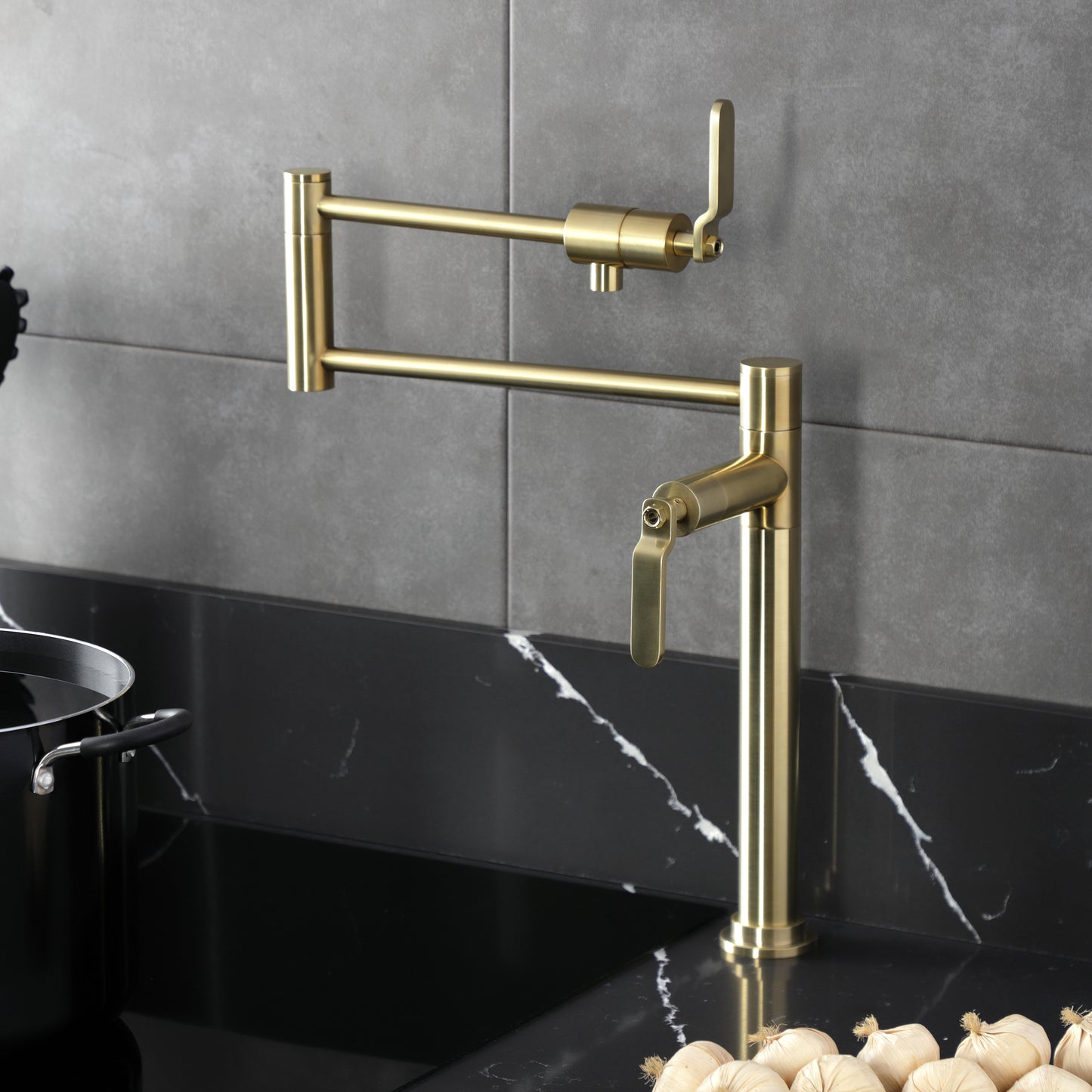 Kingston Brass KS4703KL Whitaker Deck Mount Pot Filler Faucet, Antique Brass in a modern kitchen setting.