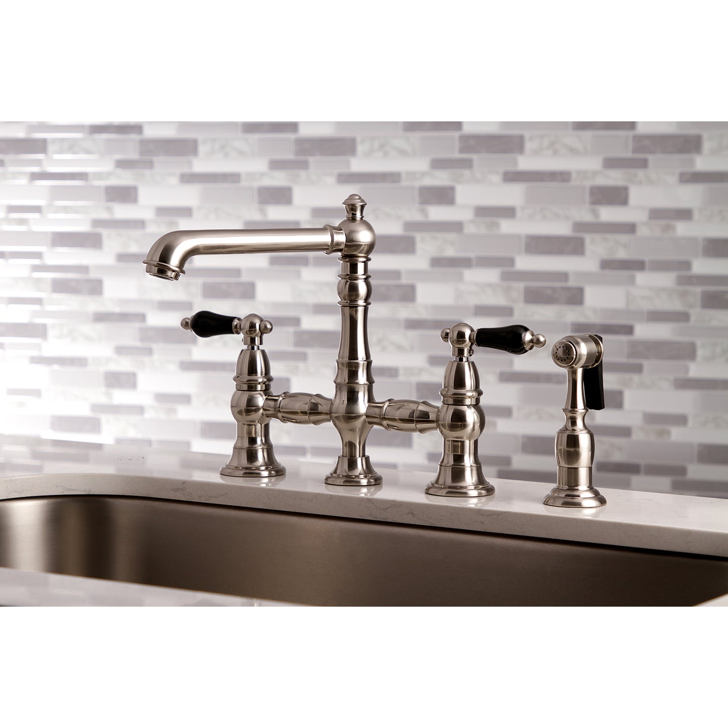 Kingston KS7277PKLBS Duchess Bridge Kitchen Faucet with Brass Sprayer, Brushed Brass in a modern kitchen setting