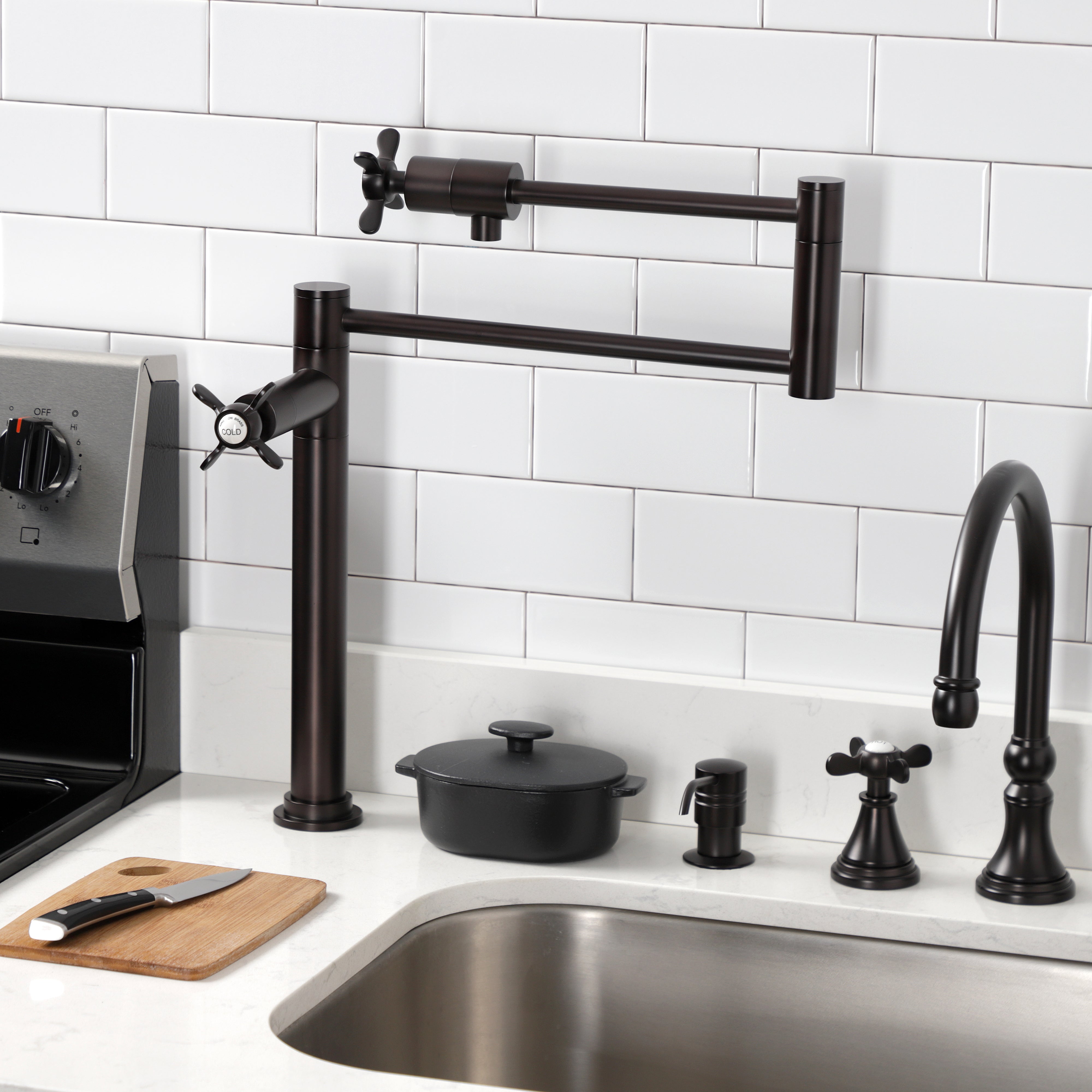 Kingston Brass KS4705BEX Essex Deck Mount Pot Filler Faucet, Oil Rubbed Bronze displayed in a modern kitchen.