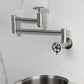 Kingston Brass KS8103RKX Webb Wall Mount Pot Filler Faucet with Knurled Handle, Antique Brass close-up image
