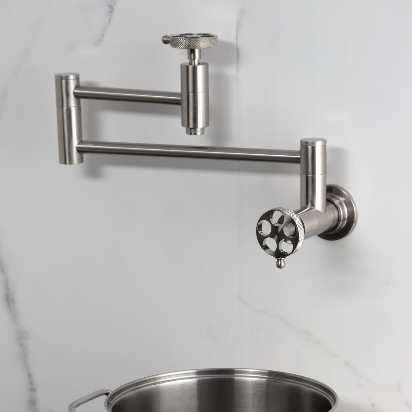 Kingston Brass KS8103RKX Webb Wall Mount Pot Filler Faucet with Knurled Handle, Antique Brass close-up image
