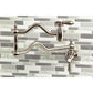 Kingston Brass KS2107BAL Heirloom Wall Mount Pot Filler Faucet, Brushed Brass mounted on mosaic tile backsplash
