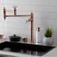 Kingston Brass KS370PXAC Restoration Deck Mount Pot Filler Faucet, Antique Copper in a modern kitchen setting.