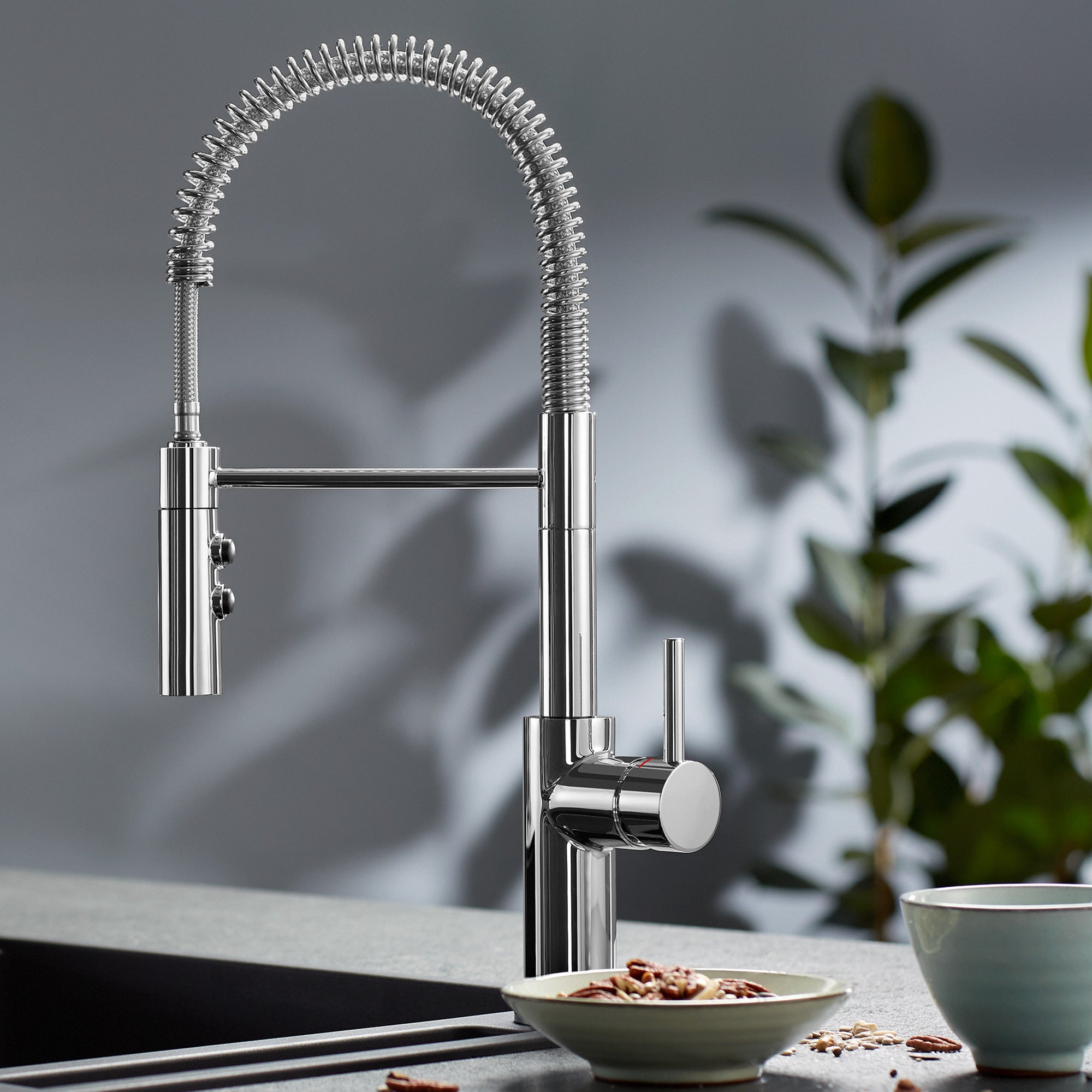 BLANCO Catris Semi-Pro Pull-Down Dual-Spray Kitchen Faucet with spring-coil design in a modern kitchen setting