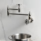 Kingston Brass KS3103RX Belknap Wall Mount Pot Filler Faucet, Antique Brass in modern kitchen setting with pot