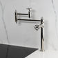 Kingston Brass KS3703RKZ Wendell Deck Mount Pot Filler Faucet with Knurled Handle, Antique Brass installed in modern kitchen.