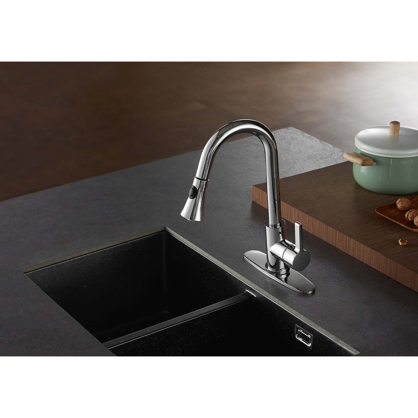 Kingston Brass LS8723CTL Continental Pull-Down Kitchen Faucet on dark countertop with double sink.