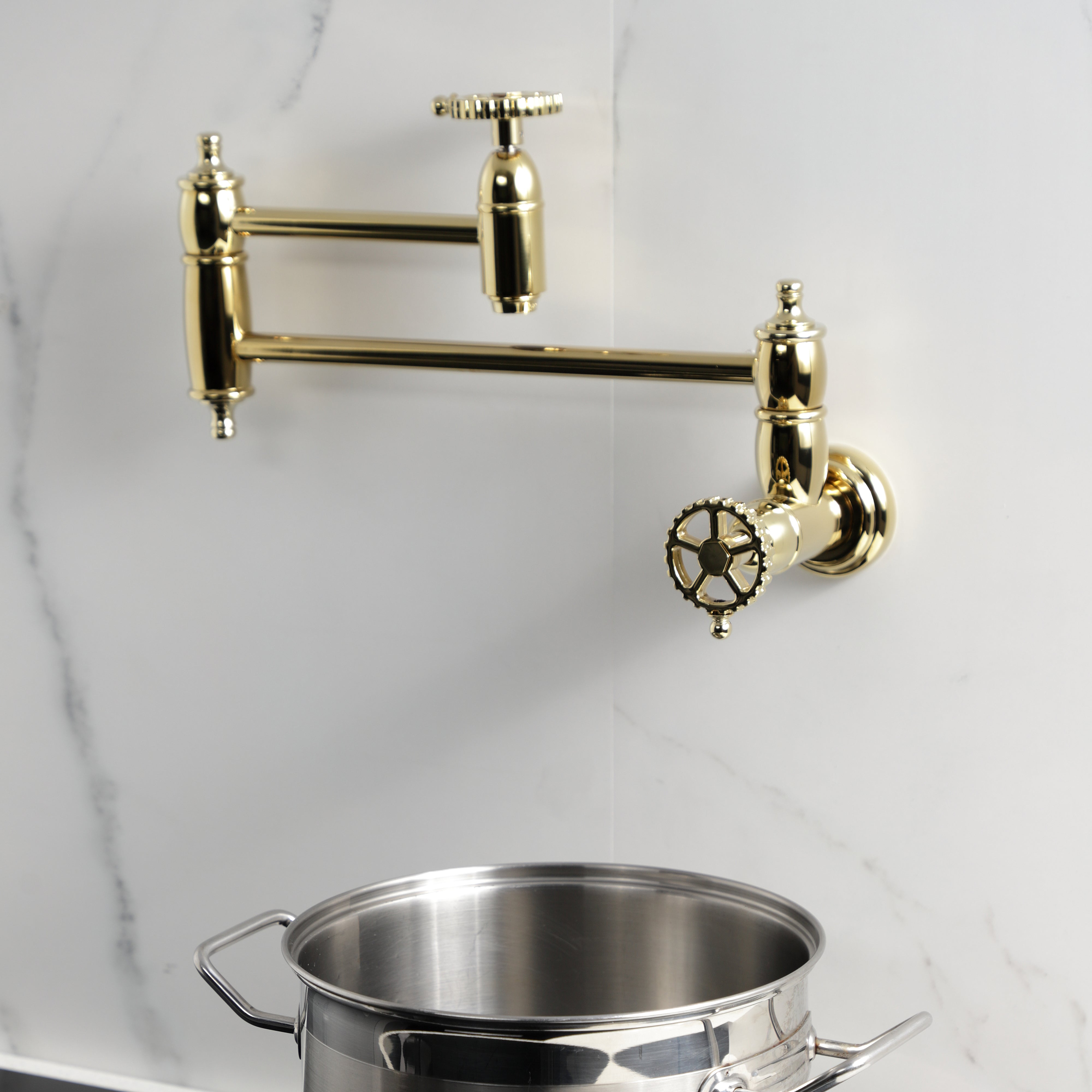 Kingston Brass KS3103CG Fuller Wall Mount Pot Filler Faucet, Antique Brass image showing elegant design and foldable swing arms.