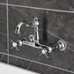 Kingston KS3253BEX Essex Two-Handle Wall Mount Bridge Kitchen Faucet, Antique Brass on a modern tiled wall.