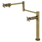 Kingston Brass KS4703DX Concord Deck Mount Pot Filler Faucet, Antique Brass in sleek design with swing arms.