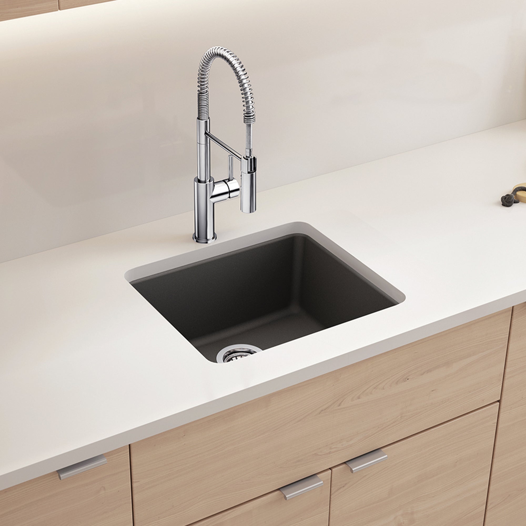BLANCO Catris Semi-Pro Pull-Down Dual-Spray Kitchen Faucet installed over a sleek, modern sink in a stylish kitchen.