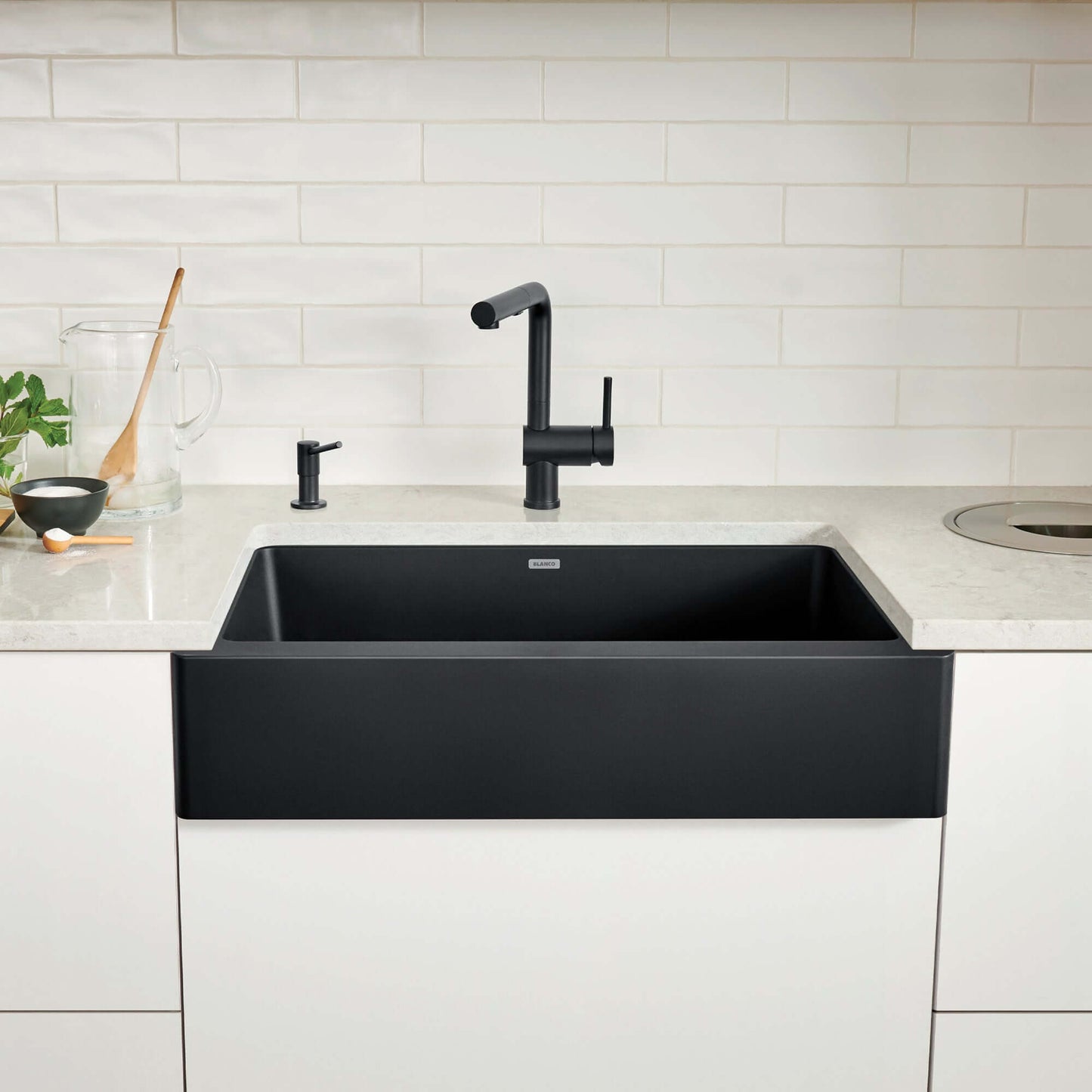 BLANCO VINTERA 30" SILGRANIT Single Bowl Farmhouse Sink in a modern kitchen with stylish faucet and countertop.