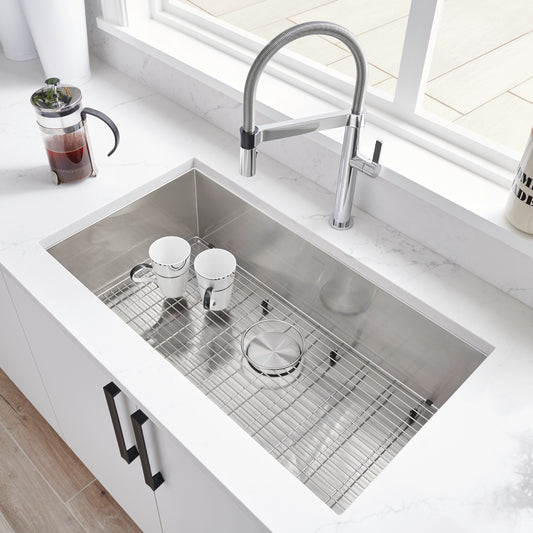 BLANCO Quatrus R0 32" Single Bowl Undermount Stainless Steel Kitchen Sink with modern faucet and drying rack.