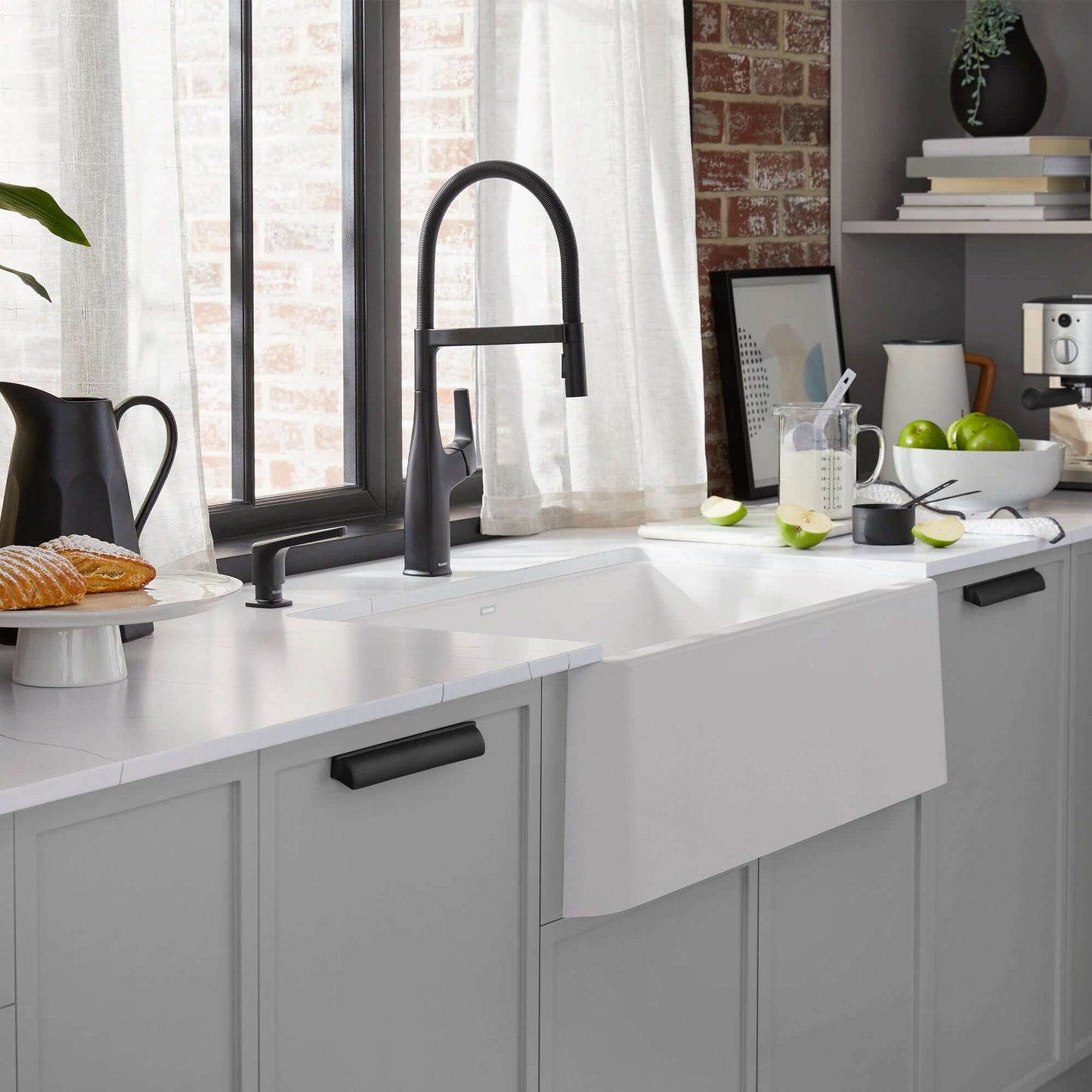 BLANCO Ikon SILGRANIT 33" Single Bowl Apron-Front Farmhouse Sink in a stylish kitchen setting with modern decor.