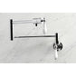 Kingston Brass KS4107PL Metropolitan Wall Mount Pot Filler Faucet, Brushed Brass with white lever handles.