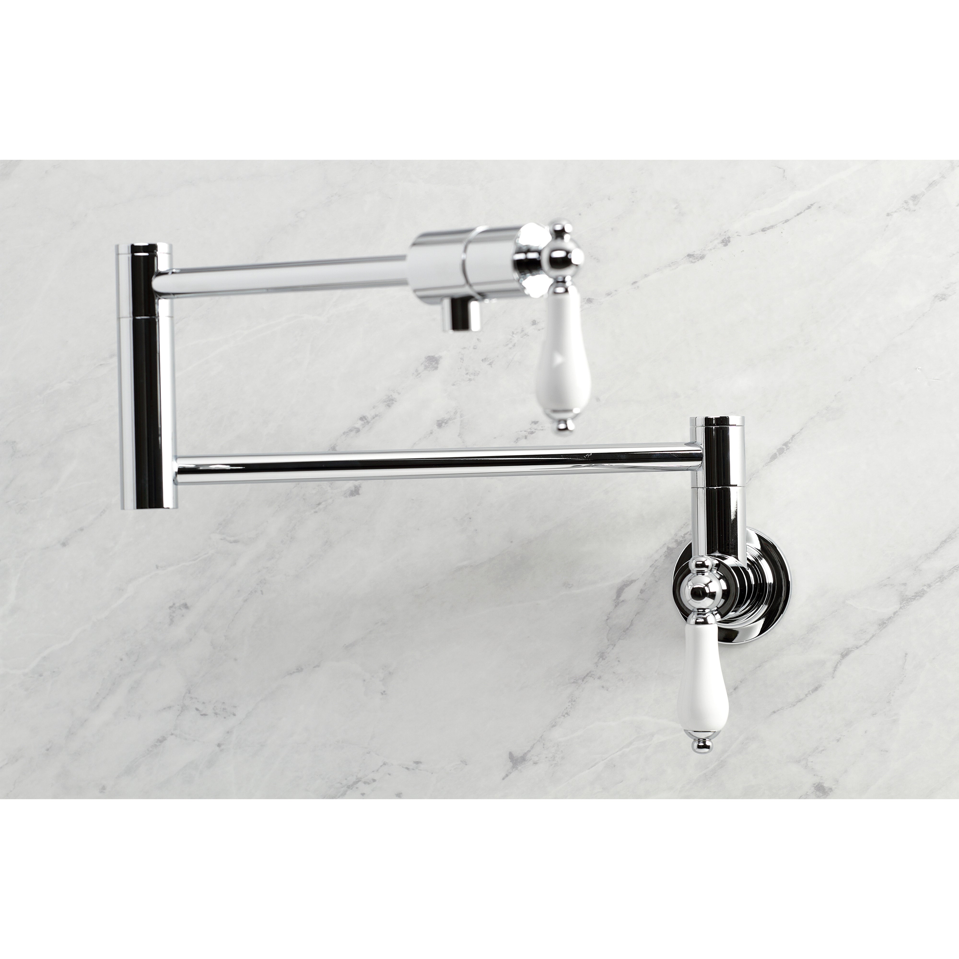 Kingston Brass KS4107PL Metropolitan Wall Mount Pot Filler Faucet, Brushed Brass with white lever handles.