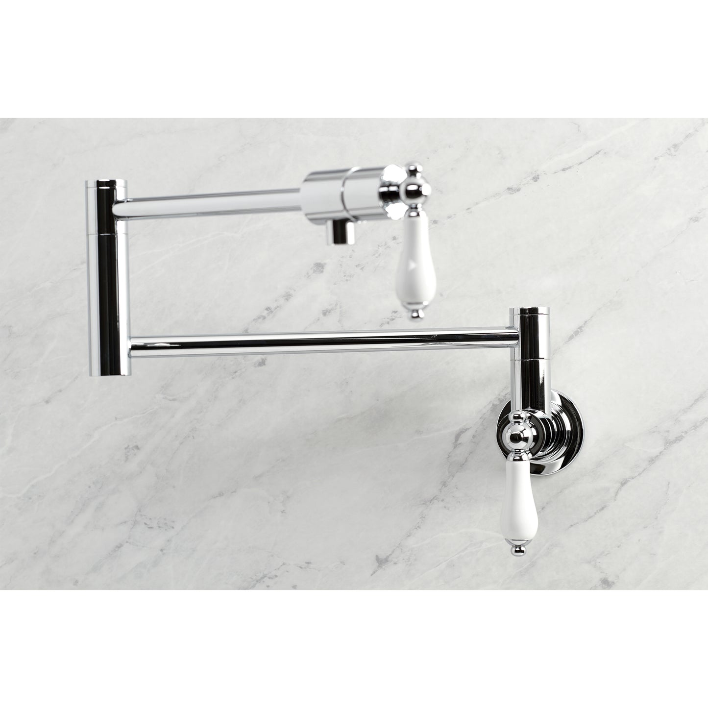 Kingston Brass KS4107PL Metropolitan Wall Mount Pot Filler Faucet, Brushed Brass with white lever handles.