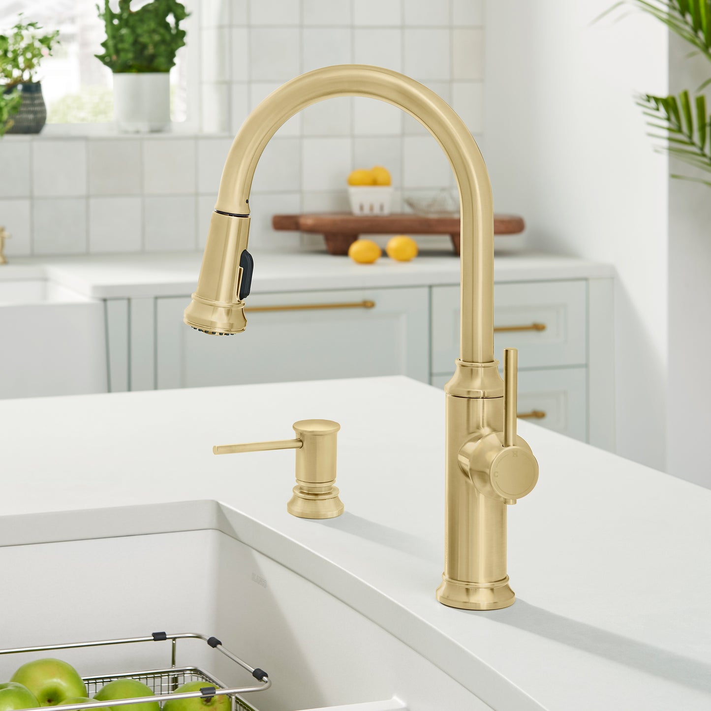BLANCO Empressa High Arc Pull-Down Dual-Spray Kitchen Faucet in gold finish on modern kitchen sink countertop.