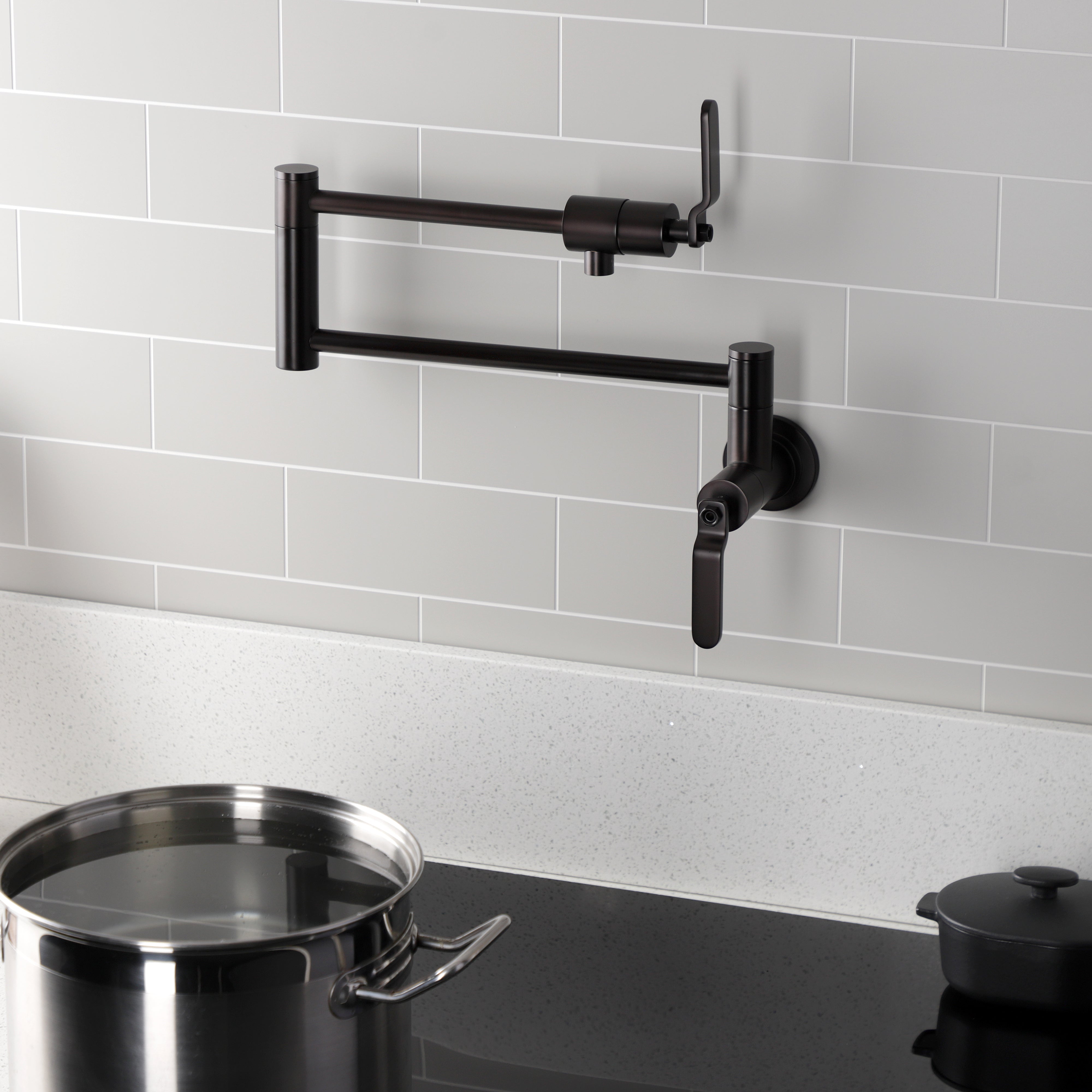 Kingston Brass KS4103KL Whitaker Wall Mount Pot Filler Faucet, Antique Brass mounted in kitchen with pot