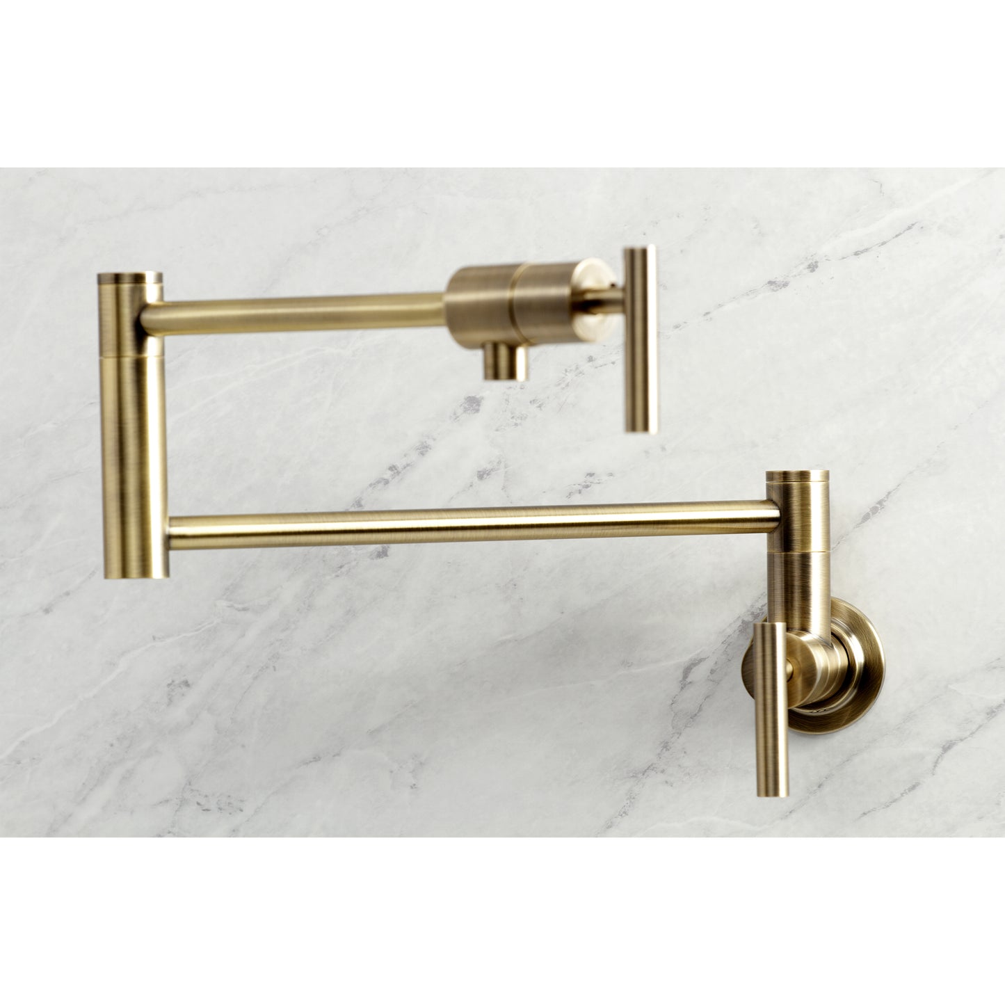 Kingston Brass KS4103CML Manhattan Wall Mount Pot Filler Faucet, Antique Brass close-up view against marble background