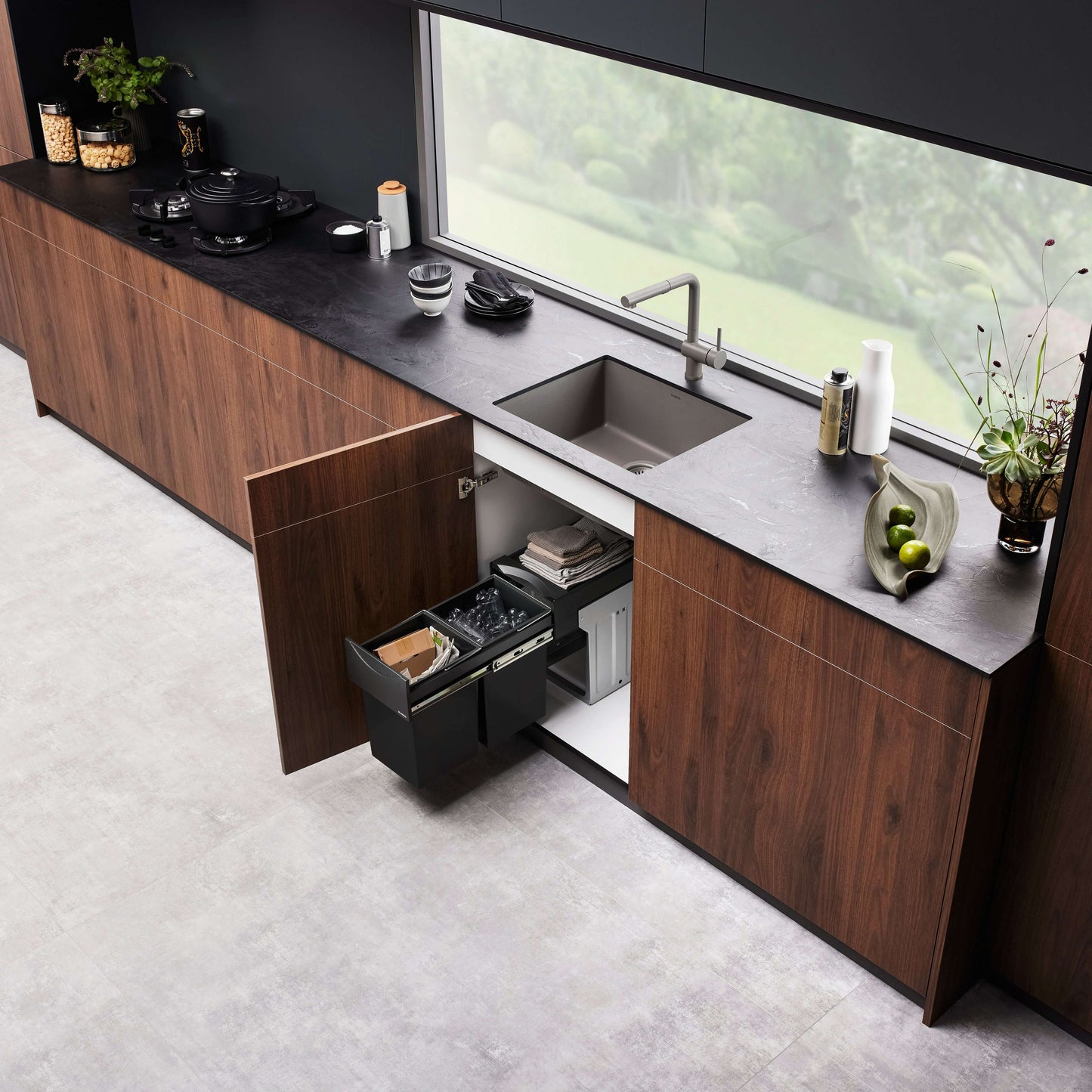 BLANCO PRECIS 24" SILGRANIT Compact Undermount Sink showcased in a modern kitchen with elegant cabinetry and decor.
