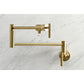 Kingston Brass KS4103CML Manhattan Wall Mount Pot Filler Faucet, Antique Brass on marble background