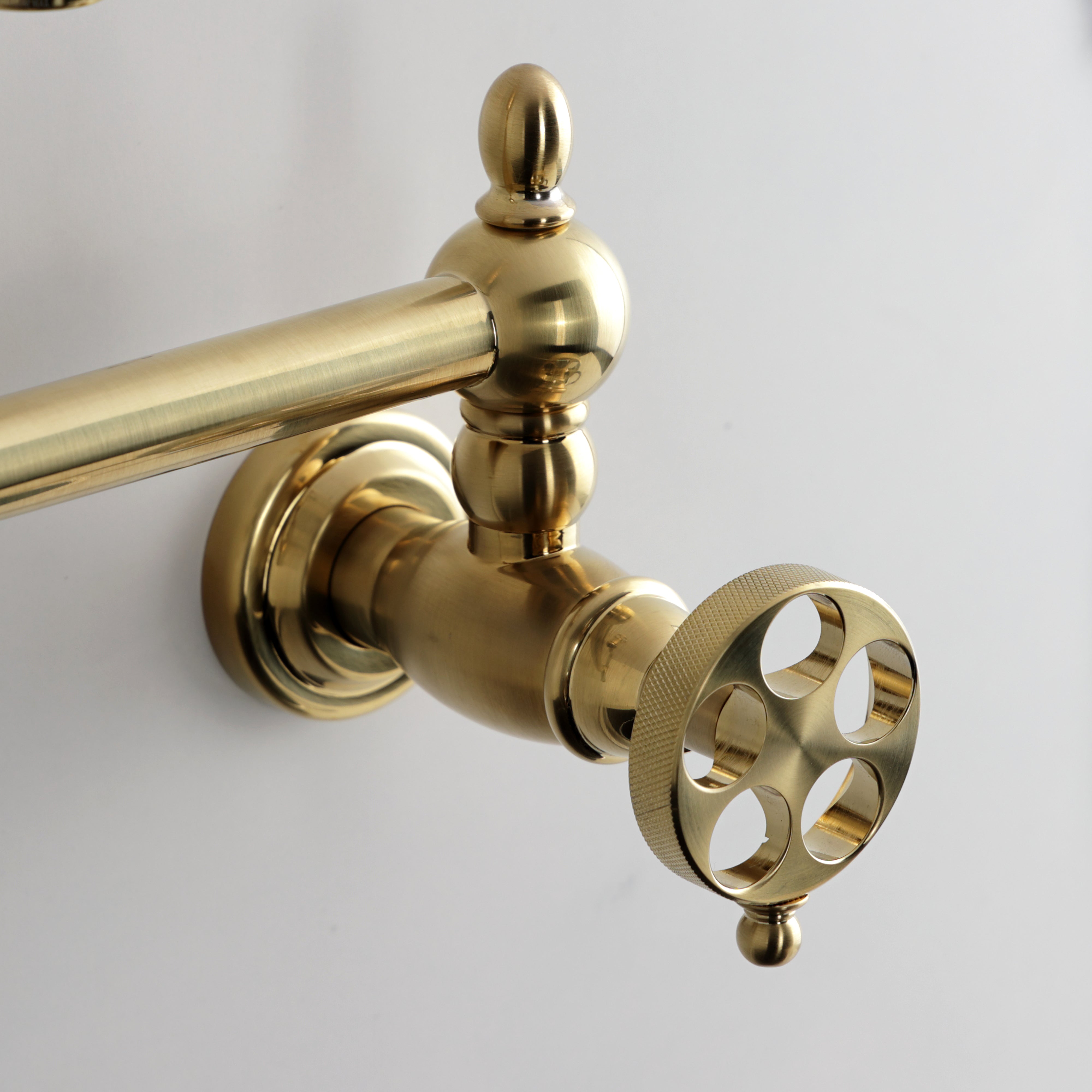 Kingston Brass KS2107RKZ Wendell Wall Mount Pot Filler Faucet with Knurled Handle, Brushed Brass close up view