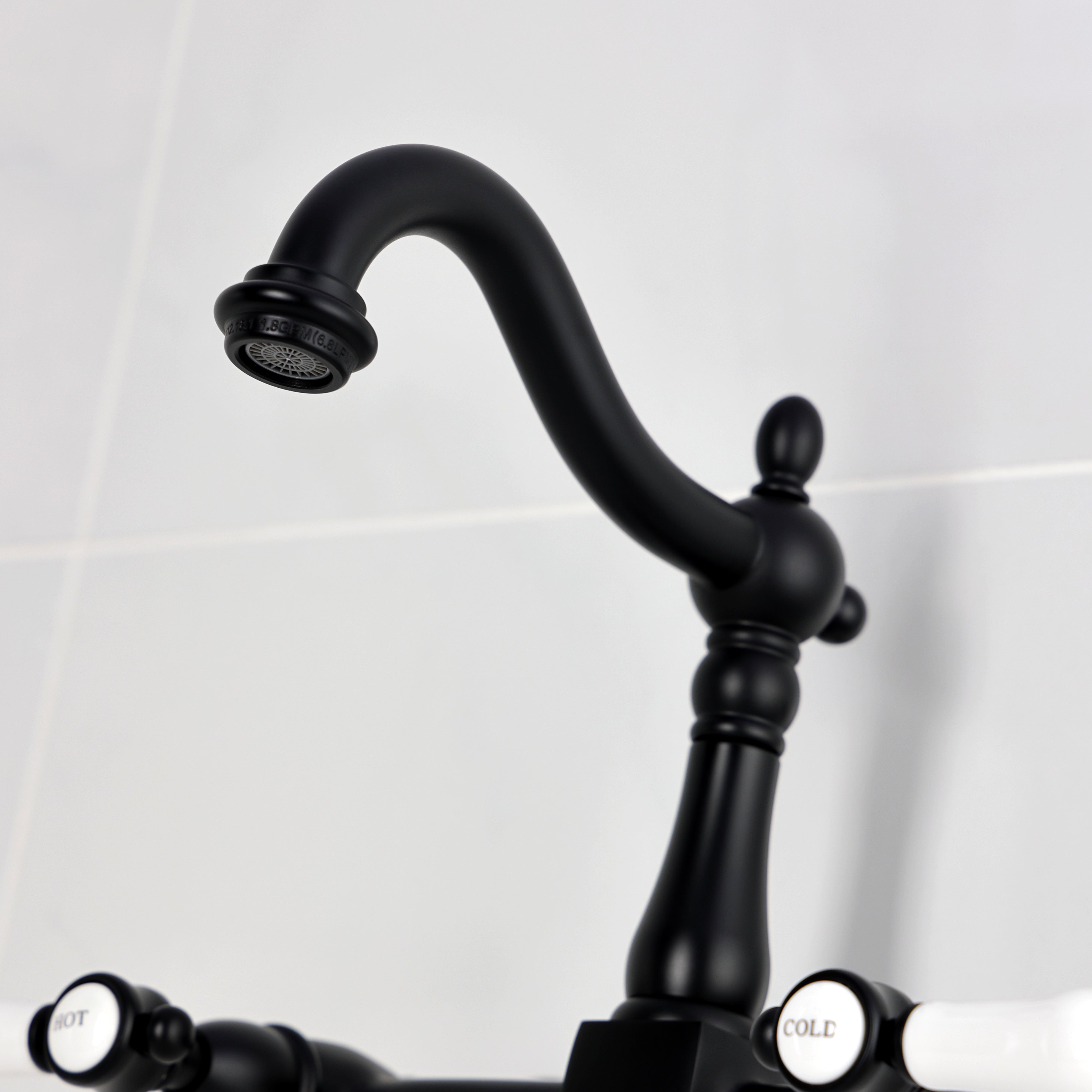 Kingston KS1263BPL Bel-Air Two-Handle Wall Mount Bridge Kitchen Faucet, Antique Brass with black finish and porcelain levers