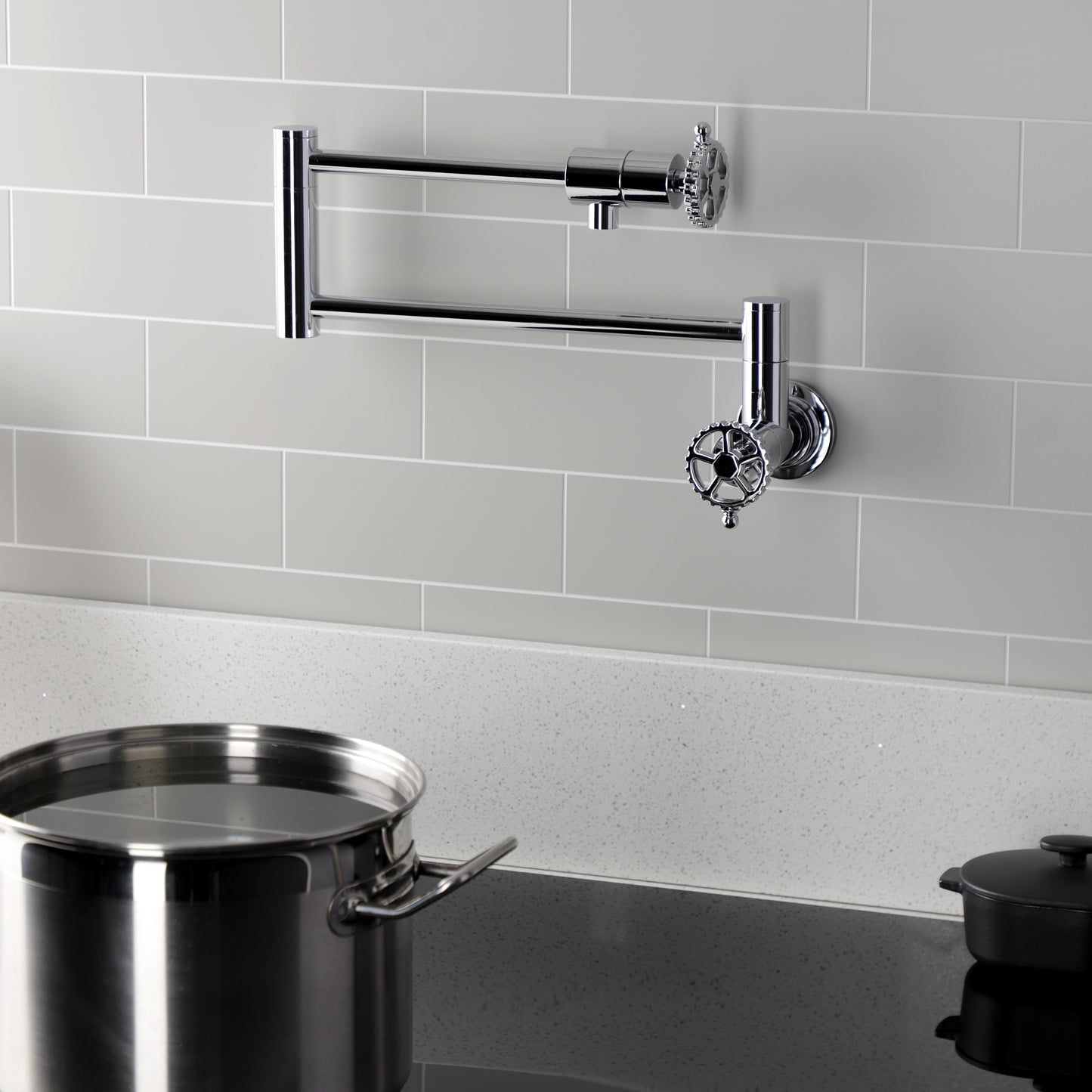 Kingston Brass KS4103CG Fuller Wall Mount Pot Filler Faucet, Antique Brass on a modern kitchen wall.