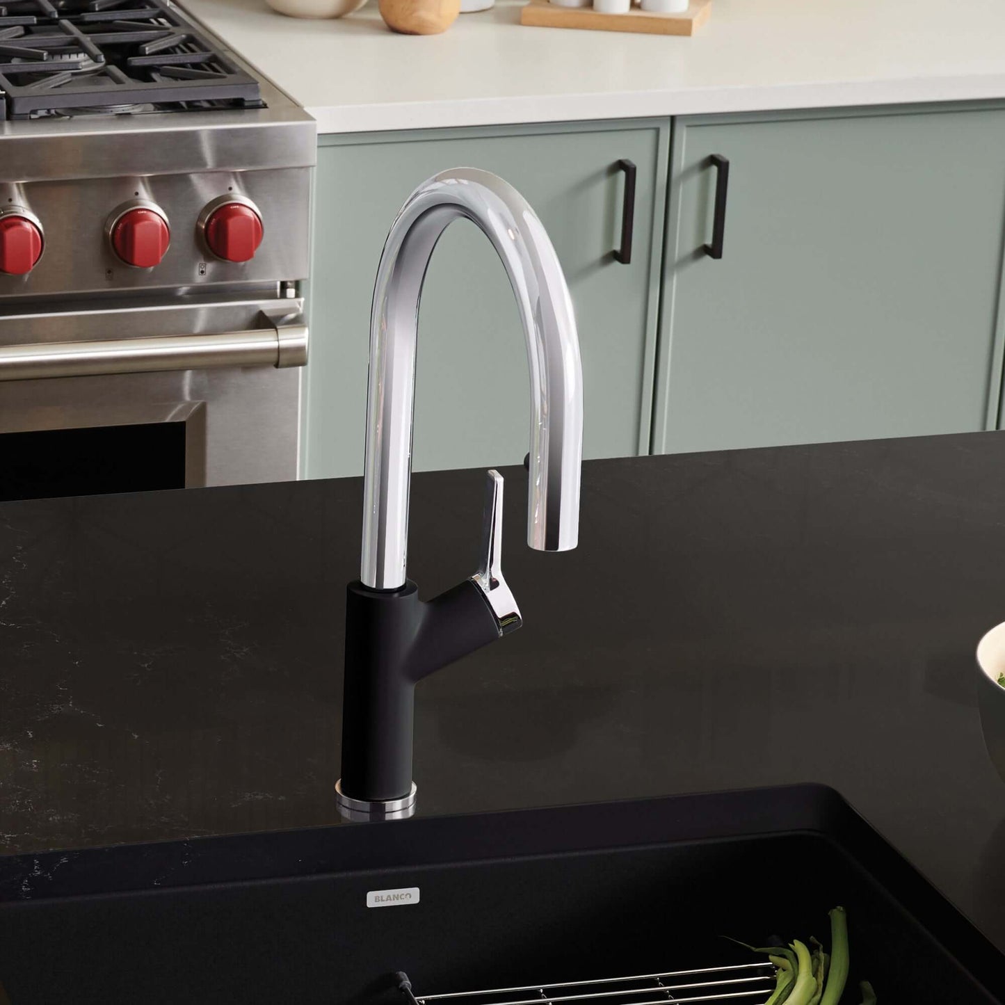BLANCO Urbena Pull-Down Dual-Spray Kitchen Faucet on modern kitchen countertop with stainless-steel sink.