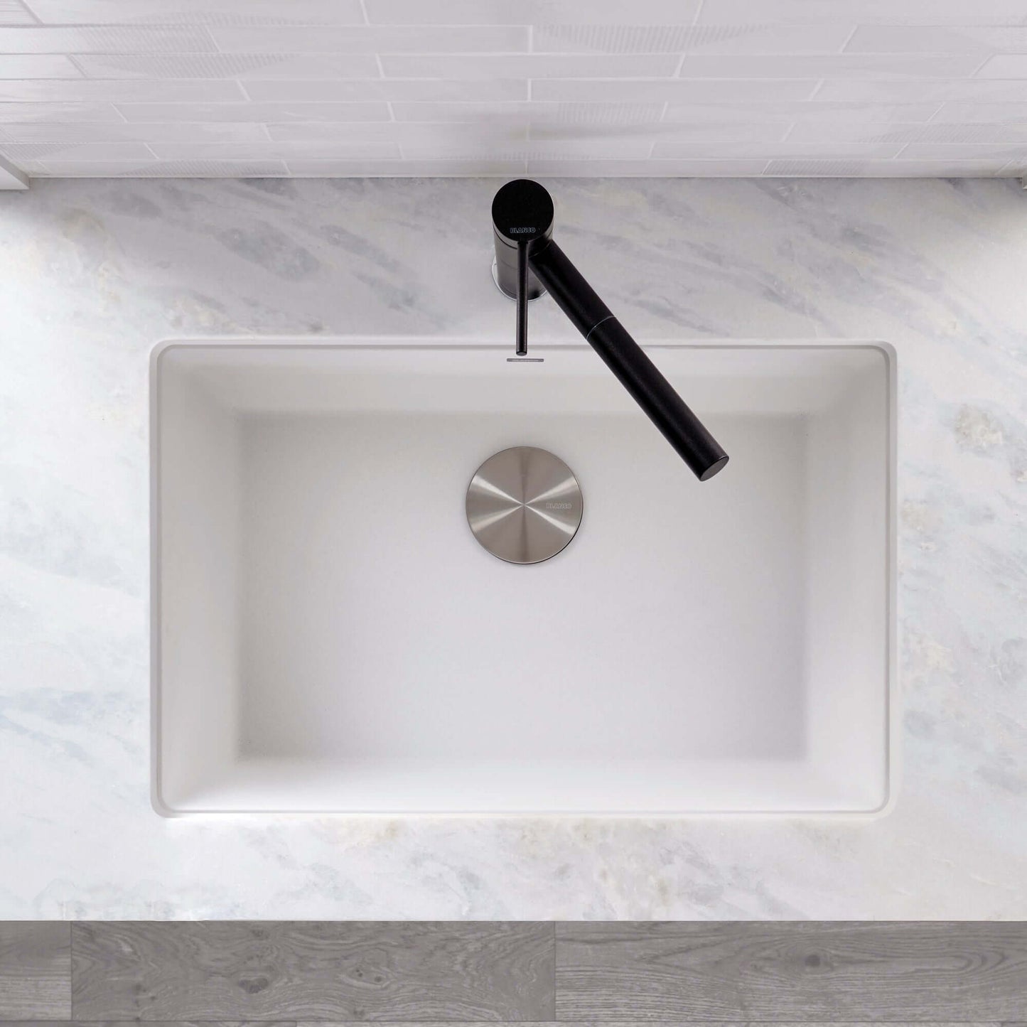 BLANCO PRECIS 27" SILGRANIT Single Bowl Undermount Sink with modern faucet on a marble countertop.
