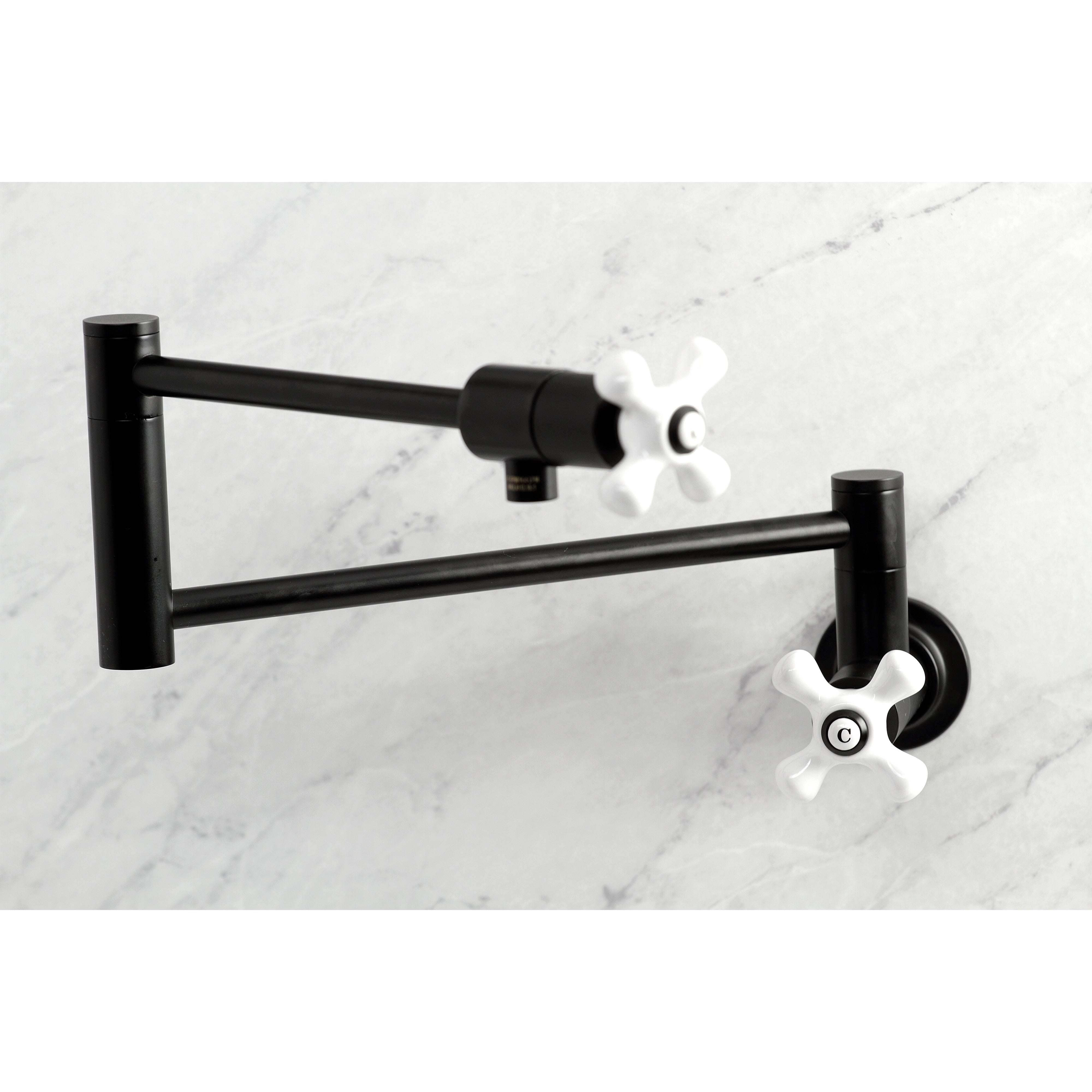 Kingston Brass KS4107PX Metropolitan Wall Mount Pot Filler Faucet, Brushed Brass, featuring swing arms and white knobs.