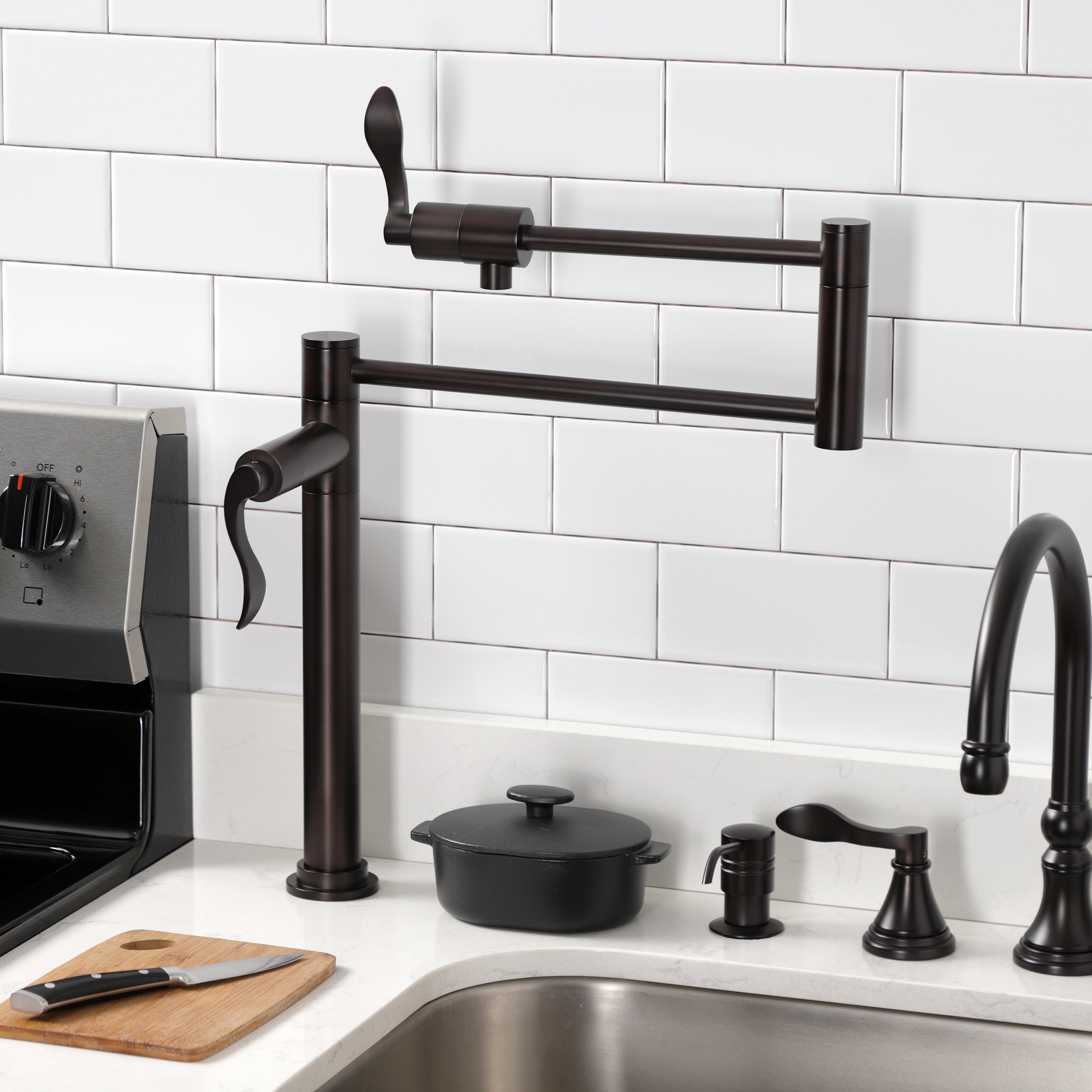 Kingston Brass KS4700DFL NuWave Deck Mount Pot Filler Faucet, Matte Black installed in kitchen.