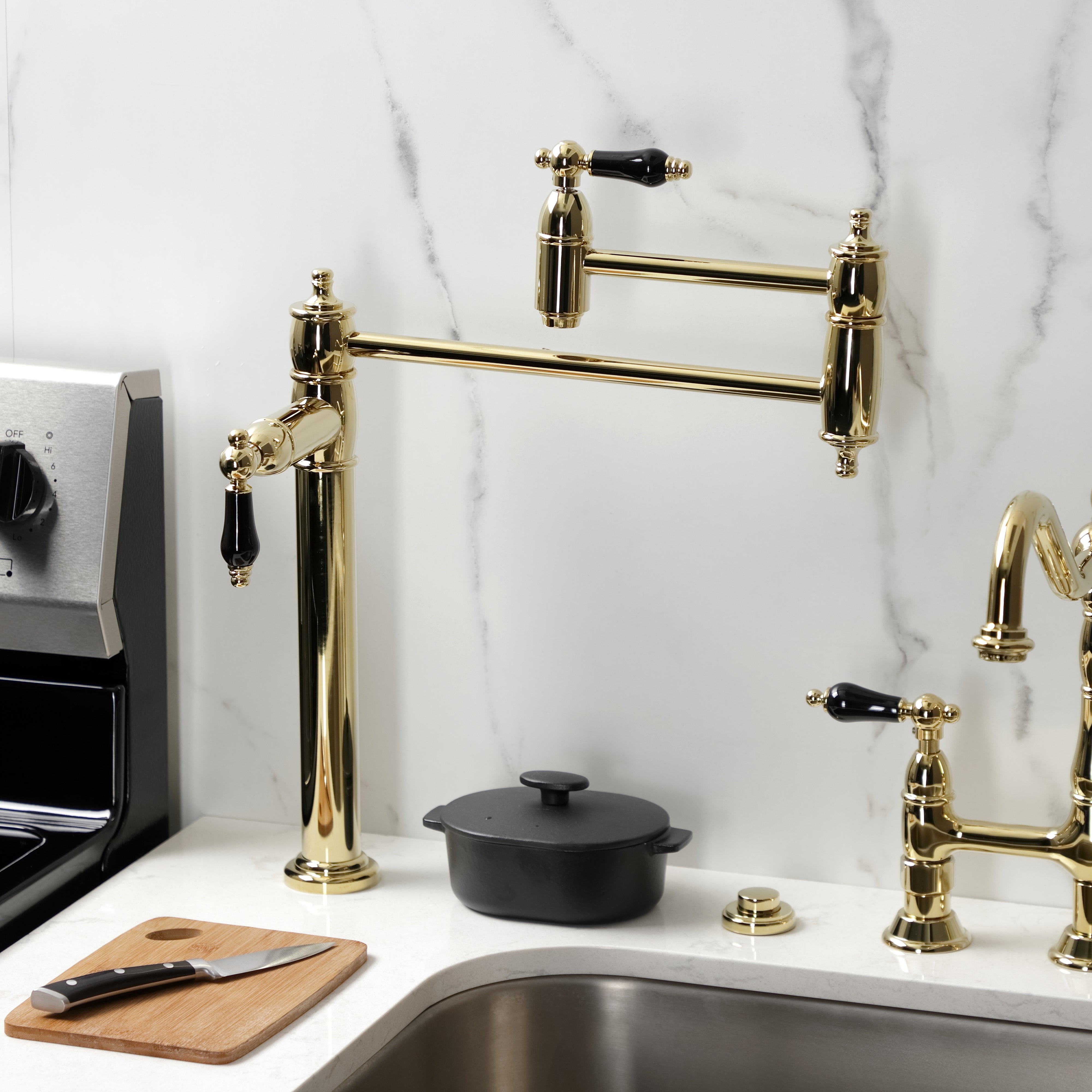 Kingston Brass KS3707PKL Duchess Deck Mount Pot Filler Faucet, Brushed Brass mounted in a modern kitchen.