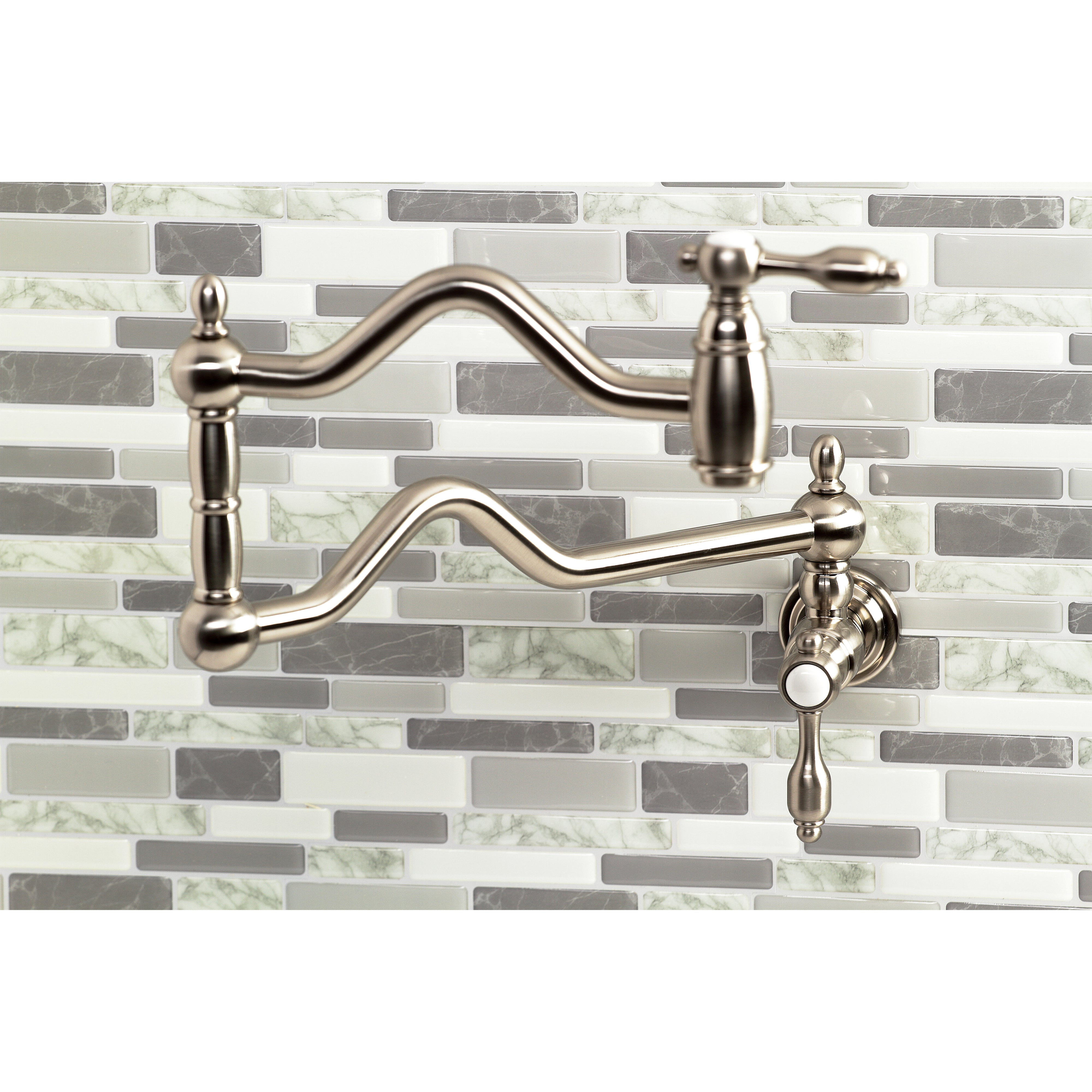 Kingston Brass KS2107TAL Tudor Wall Mount Pot Filler Faucet, Brushed Brass against modern tile backsplash.