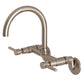 Kingston Brass KS814SB Concord Wall Mount Bridge Kitchen Faucet with gooseneck design and dual handles.