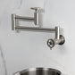 Kingston Brass KS8103CG Fuller Wall Mount Pot Filler Faucet, Antique Brass design with foldable swing arms.
