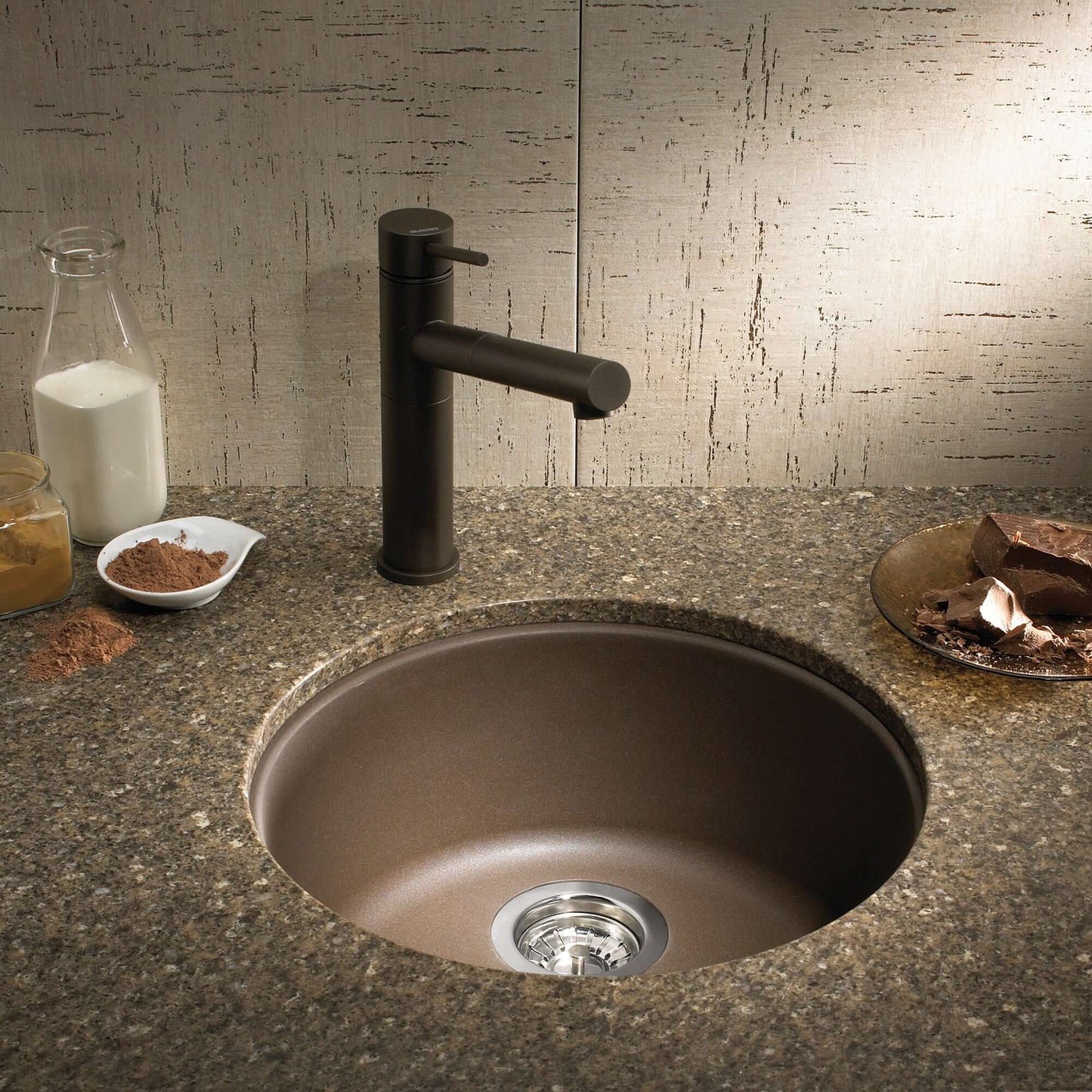 BLANCORONDO SILGRANIT 18" Dual Mount Bar Sink with modern faucet on a stone countertop.