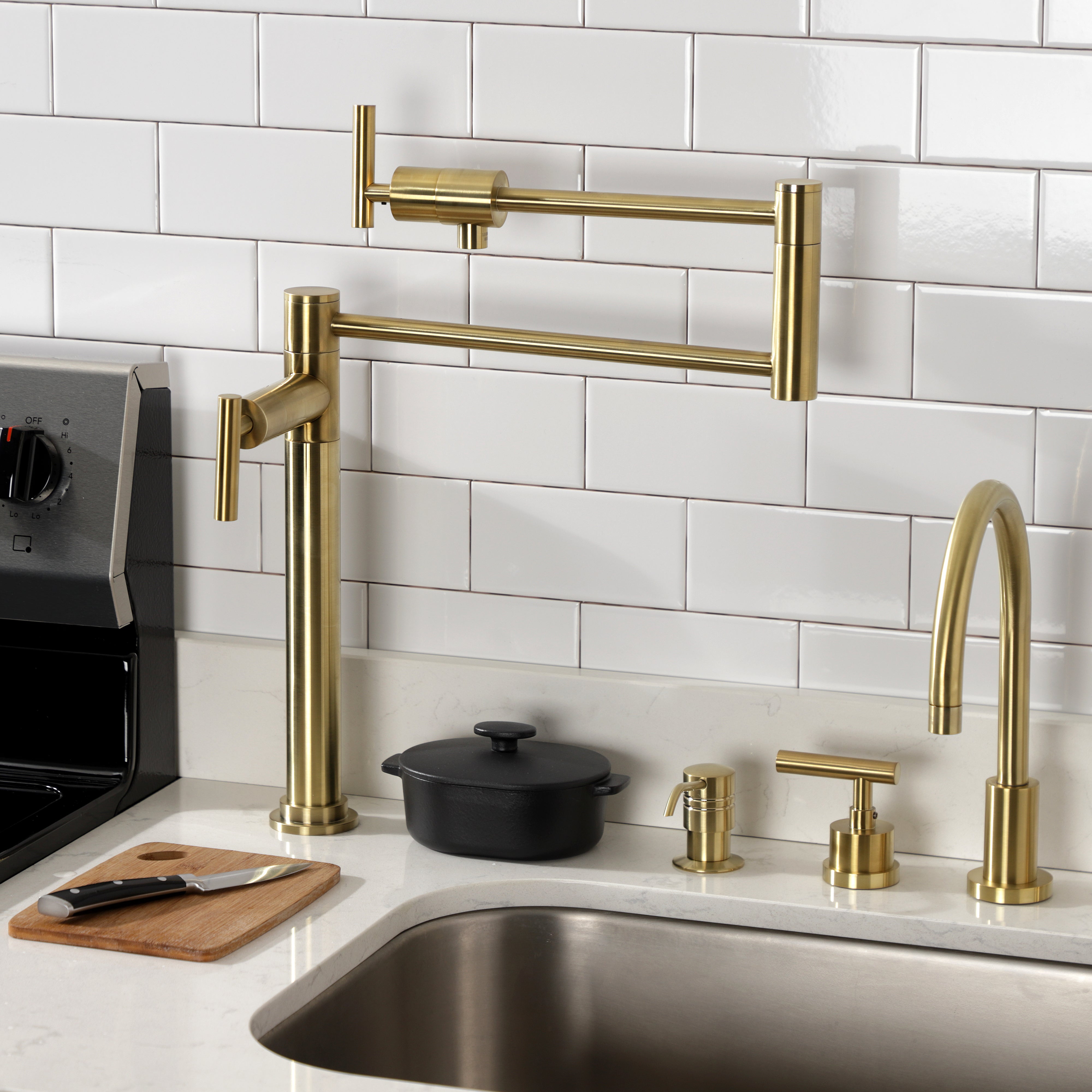 Kingston Brass KS4703CML Manhattan Deck Mount Pot Filler Faucet, Antique Brass in a modern kitchen setting.